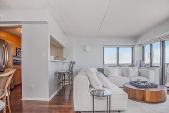 a living room with a white couch and a table